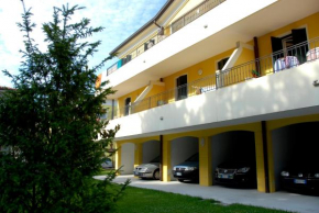 Enjoy the view of the garden from our balcony Bibione